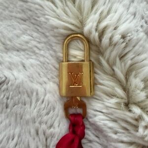 Louis Vuitton Gold Padlock with Red Accent